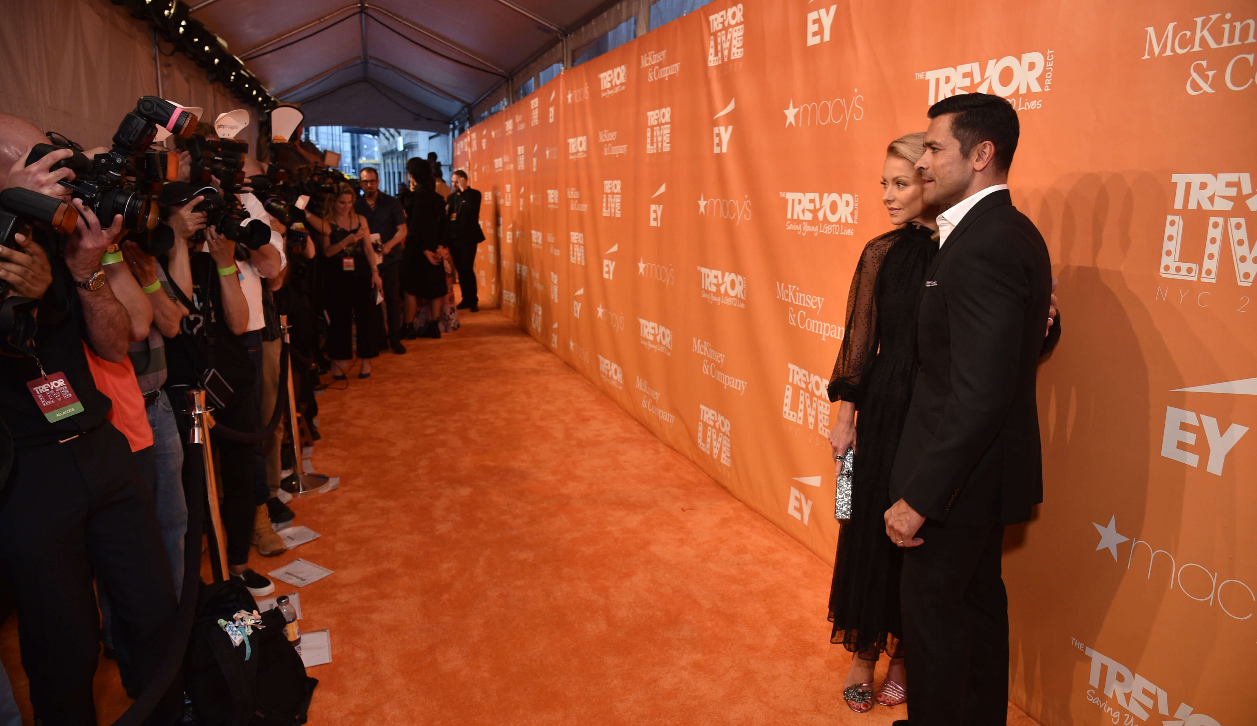 Kelly Ripa and Mark Consuelos in Front of the Orange Carpet Step & Repeat